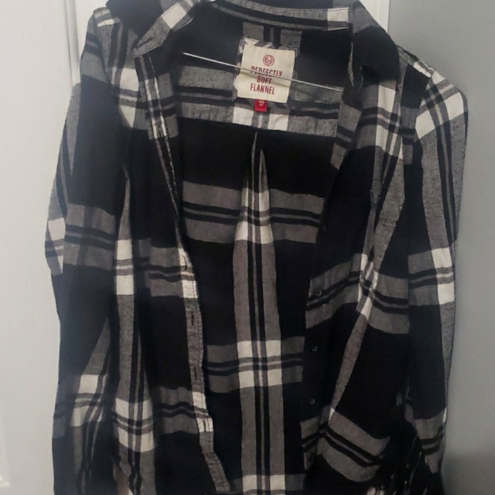Black, grey, and white long sleeve flannel.